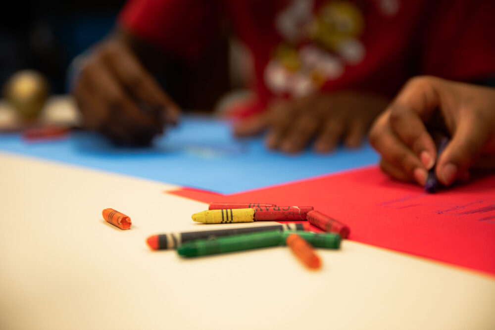 Students coloring in classroom