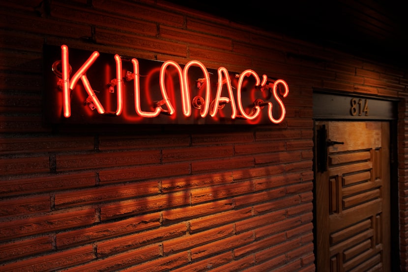 A small neon sign outside of Kilmac's welcomes customers to the bar. The longtime building...