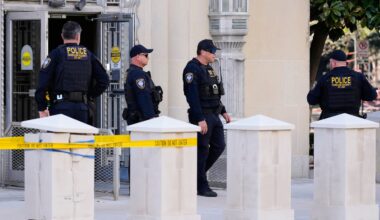 Officers with the Department of Homeland Security stood outside the Eldon B. Mahon US Courthouse Thursday during a trial for nine people connected to a 2025 shooting outside an ICE detention facility, in Fort Worth, Texas.