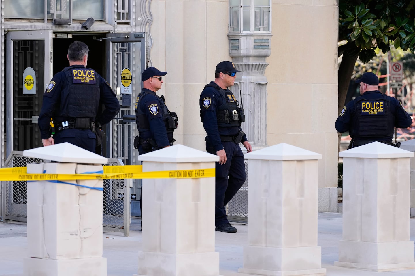 Officers with the Department of Homeland Security stood outside the Eldon B. Mahon US Courthouse Thursday during a trial for nine people connected to a 2025 shooting outside an ICE detention facility, in Fort Worth, Texas.