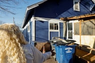 Zabrina Chism, 54, points to work that was left incomplete by contractors with the city of...