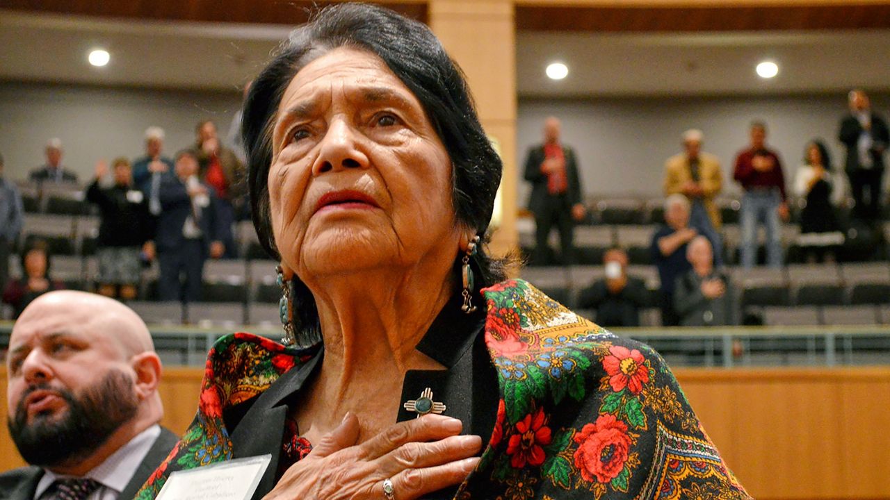 Dolores Huerta, the Mexican-American social activist who formed a farm workers union with Cesar Chavez, stands for the Pledge of Allegiance in Spanish while visiting the New Mexico Statehouse in Santa Fe. N.M., on Feb. 27, 2019. (AP Photo/Russell Contreras)