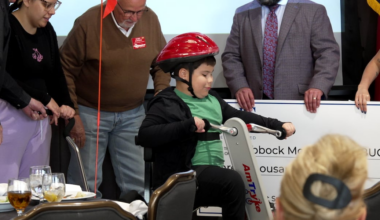 Local 8-year-old receives adaptive tricycle from AMBUCS