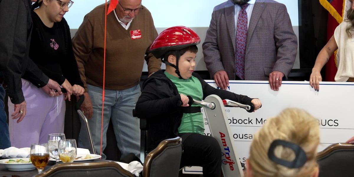 Local 8-year-old receives adaptive tricycle from AMBUCS