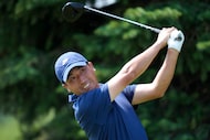 Doug Ghim watches his tee shot on the second hole during the third round of the 3M Open golf...