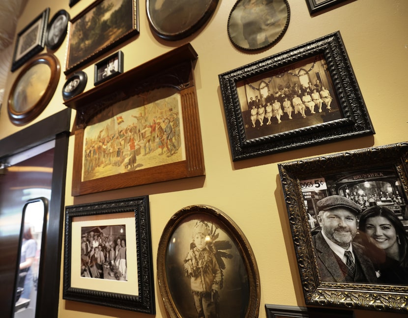A wall of artwork at Shorty's in McKinney includes black-and-white photos of inspiration,...