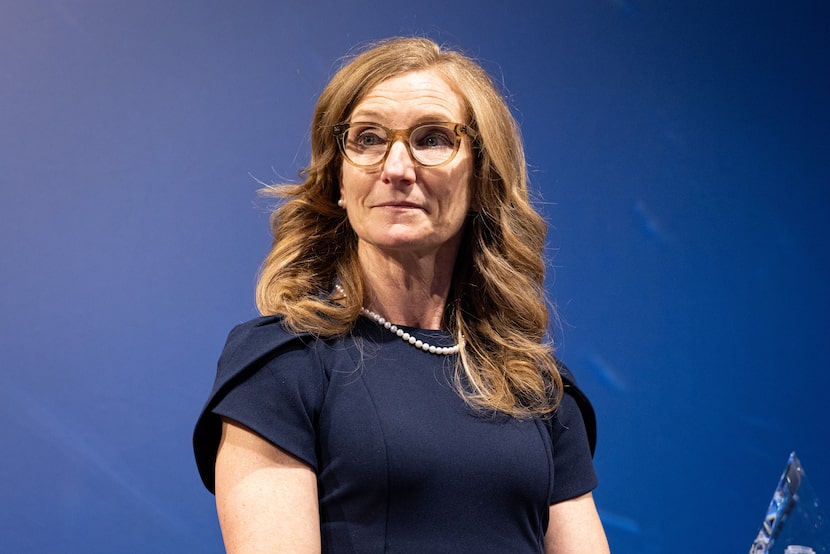 Phedra Redifer, Workforce Solutions for North Central Texas executive director, gives out...