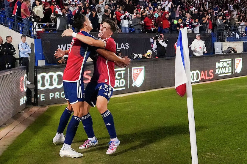 FC Dallas forward Petar Musa (9) celebrates with forward Logan Farrington (23) after scoring...