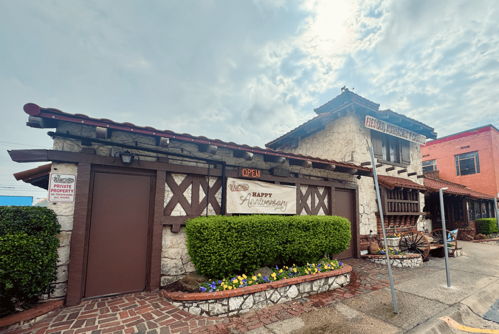 The east side of El Ranchito showcasing the heavy timber rafters and limestone walls.