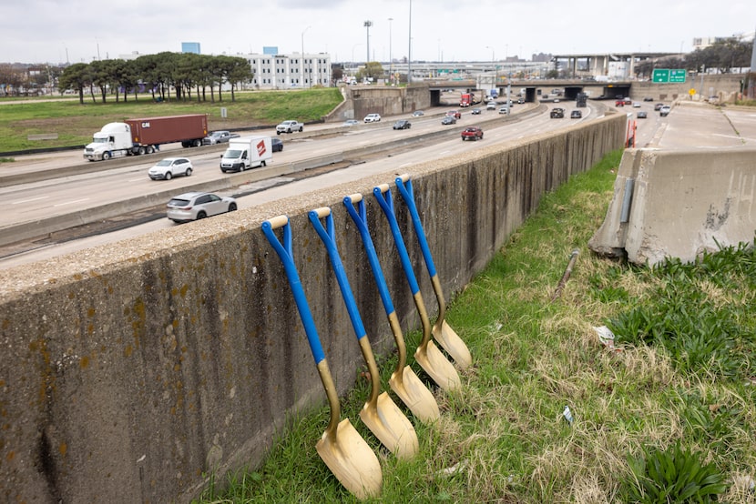 Ceremonial shovels rest on a wall overlooking Interstate 30 before a groundbreaking for the...