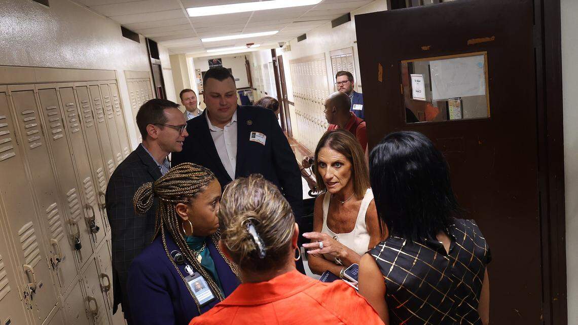 Fort Worth Independent School District Superintendent Karen Calvert Molinar, right, talks with others while State Education Commissioner Mike Morath, back left, visits William James Middle School on Thursday, Aug. 28, 2025.