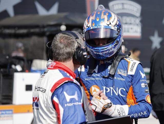 Scott Dixon (9) gets a briefing on pit row before the inaugural Java House Grand Prix of Arlington in Arlington, Texas, Sunday, March, 15, 2026.