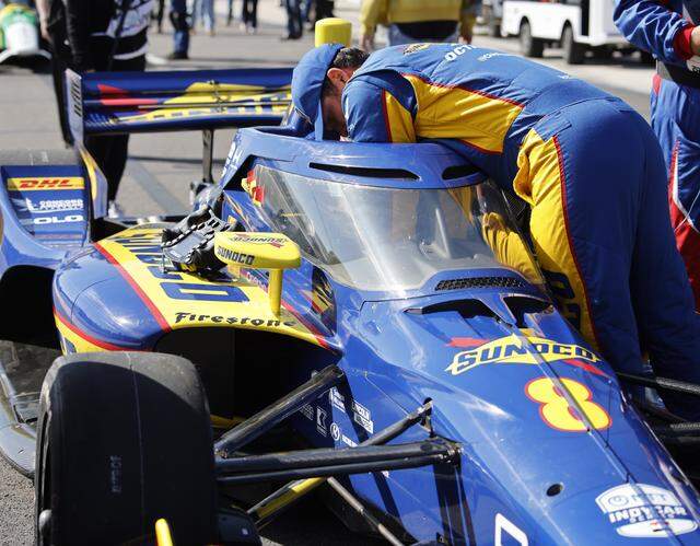 Kyffin Simpson's (8) pit crew work on adjusting his cockpit during the inaugural Java House Grand Prix of Arlington in Arlington, Texas, Sunday, March, 15, 2026.