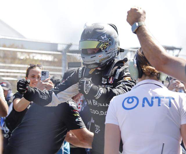 Kyle Kirkwood (27) exits his Andretti Honda and pumps his fists after winning the inaugural Java House Grand Prix of Arlington in Arlington, Texas, Sunday, March, 15, 2026.