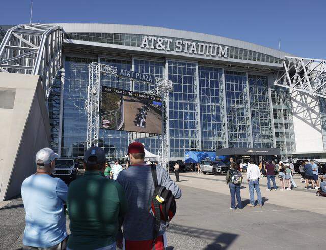 Fans watch the race on several jumbo trans placed around ATT Stadium, Globe Life Field and the race track during the inaugural Java House Grand Prix of Arlington in Arlington, Texas, Sunday, March, 15, 2026.