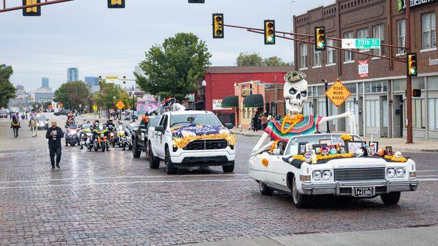 Parade participants ride in their float on Main Street for the Dia De Los Muertos Parade in Northside Fort Worth on Saturday, Nov. 1, 2025.