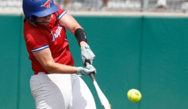Grapevine first baseman Brynn Snyder (13) gets a hit down the third base line during game 2 of the UIL softball semifinal 5A D2 playoffs at The Rabbit Hole in Forney, Texas, Saturday, May 24, 2025.