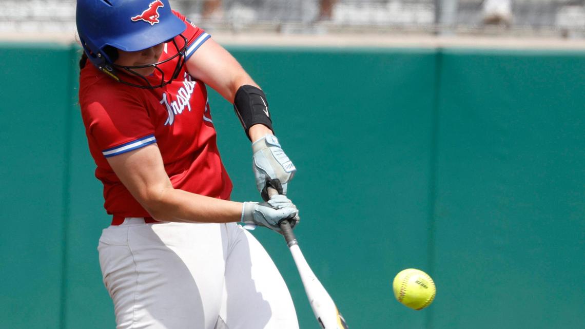 Grapevine first baseman Brynn Snyder (13) gets a hit down the third base line during game 2 of the UIL softball semifinal 5A D2 playoffs at The Rabbit Hole in Forney, Texas, Saturday, May 24, 2025.