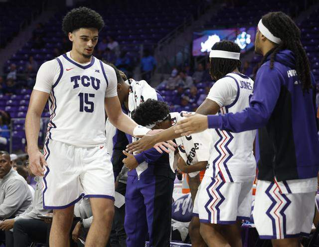 TCU forward David Punch (15) returns to the bench during the second half of a NCAA basketball game between New Orleans University and TCU at Schollmaier Arena in Fort Worth, Texas, Monday Nov. 03, 2025. The Horned Frogs dropped their home opener 78-74 to the Privateers.