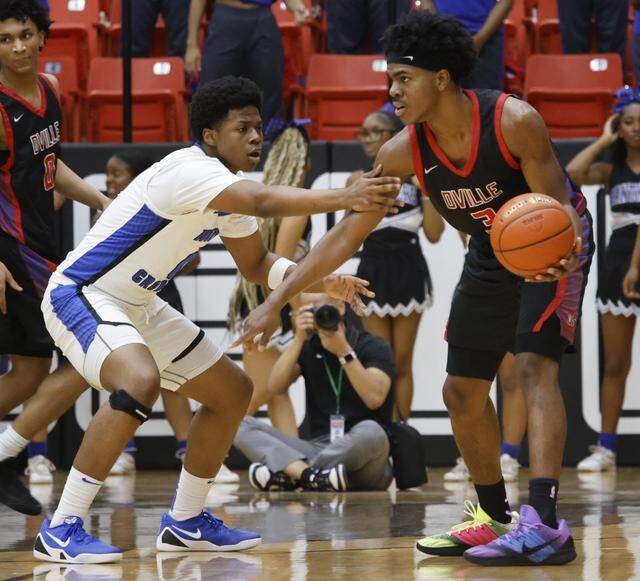 North Crowley wing Bennjamin Jones (0) defends against Duncanville guard Jirehn Mitchell (3) during the first half of a UIL Class 6A Division I boys semifinal basketball game at Wilkerson-Greines Activity Center in Fort Worth, Texas, on Tuesday, March 10, 2026.