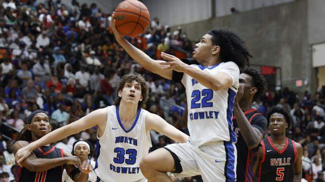 North Crowley guard Isaak Hayes (22) puts one in against Duncanville during the first half of a UIL Class 6A Division I boys semifinal basketball game at Wilkerson Greines Activity Center in Fort Worth, Texas, Monday, Mar. 10, 2026.