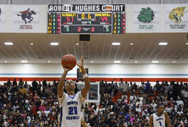 North Crowley wing Jonathan Fox (21) seals the game with two free throws against Duncanville during the second half of a UIL Class 6A Division I boys semifinal basketball game at Wilkerson Greines Activity Center in Fort Worth, Texas, Monday, Mar. 10, 2026.