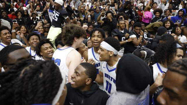 Players celebrated their win against Duncanville with fans and the football team during the second half of a UIL Class 6A Division I boys semifinal basketball game at Wilkerson-Greines Activity Center in Fort Worth, Texas, Monday, March 10, 2026.