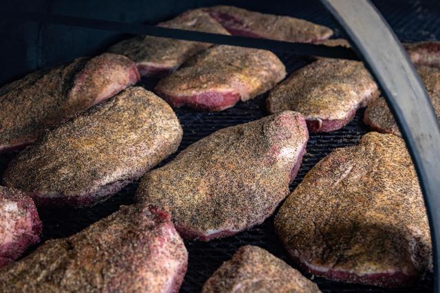 Brisket lays in the smoker before cooking at Goldee’s Barbecue in Fort Worth on Saturday, April 22, 2023.
