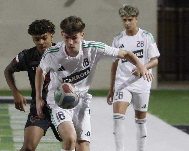 Southlake Carroll’s Josh Dyer (18) keeps the ball out in front against Mansfield Legacy during the first half of a UIL bi-district round soccer playoff game at Crowley ISD Multi-Purpose Stadium in Fort Worth, Texas, on Friday, March 20, 2026.
