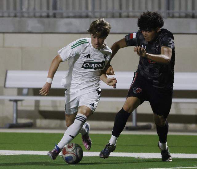 Southlake Carroll’s John Skiermont and Mansfield Legacy forward Jeremiah Kieffer go after the ball during the second half of a UIL bi-district round soccer playoff game at Crowley ISD Multi-Purpose Stadium in Fort Worth, Texas, on Friday, March 20, 2026.