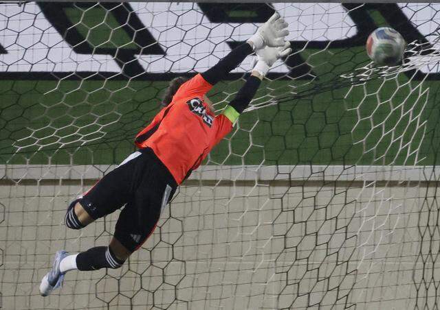Southlake Carroll keeper Graham Byrne stops a shot from Mansfield Legacy during the second half of a UIL bi-district round soccer playoff game at Crowley ISD Multi-Purpose Stadium in Fort Worth, Texas, on Friday, March 20, 2026.