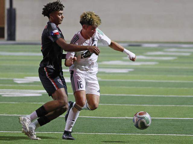 Southlake Carroll’s Lucas Bollon dribbles the ball ahead of Mansfield Legacy defender Josiah Yorke during the first half of a UIL bi-district round soccer playoff game at Crowley ISD Multi-Purpose Stadium in Fort Worth, Texas, on Friday, March 20, 2026.