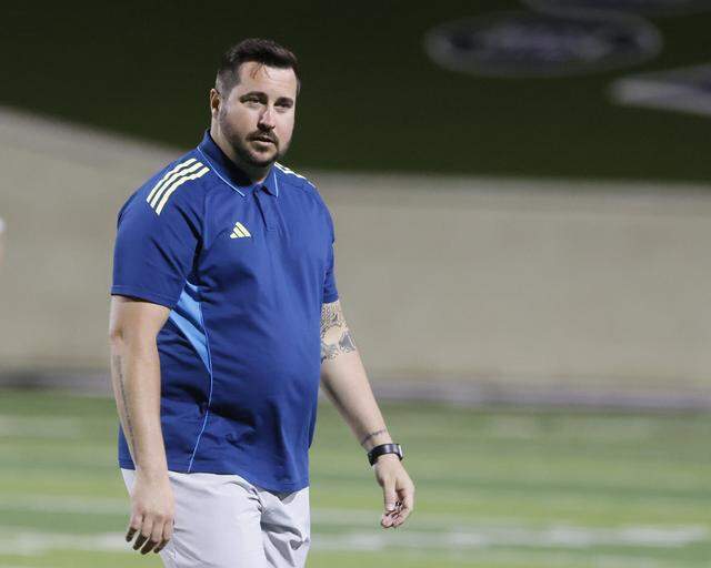 Southlake Carroll head coach Chris Padilla walks back to the bench after checking on an injured player as his team plays Mansfield Legacy at Crowley ISD Multi-Purpose Stadium in Fort Worth, Texas, on Friday, March 20, 2026.