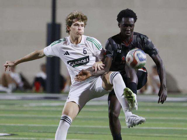 Southlake Carroll’s Graham Buete and Mansfield Legacy’s Wahab Emmanuel work the middle of the pitch during the first half of a UIL bi-district round soccer playoff game at Crowley ISD Multi-Purpose Stadium in Fort Worth, Texas, on Friday, March 20, 2026.