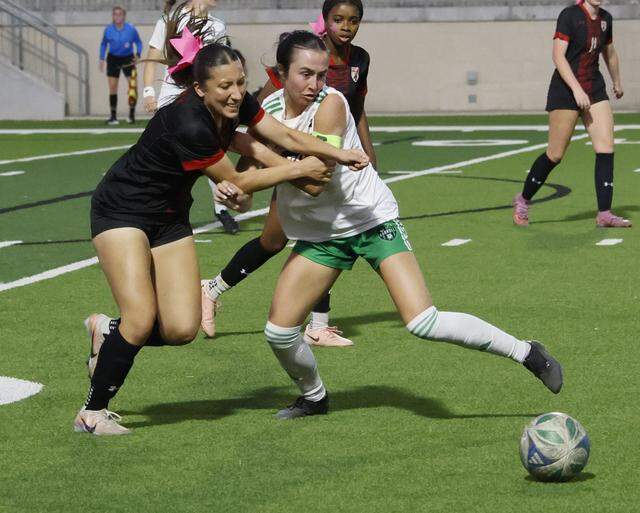 Mansfield Legacy forward Madeline Guzman (8) and Southlake Carroll midfielder Payton Hayes (3) battle for control during the second half of a UIL bi-district round soccer playoff game at Crowley ISD Multi-Purpose Stadium in Fort Worth, Texas, on Friday, March, 20, 2026.