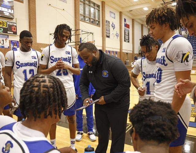 Mansfield Summit head coach Emund Prichett draws up a play during timeout against Everman in the first half of a UIL boys basketball game between Everman and Mansfield Summit at Summit High School in Mansfield, Texas, Thursday Jan. 22, 2026