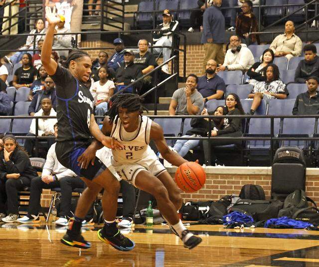 Mansfield Timberview guard Jonathan Williams (2) turns the corner on Mansfield Summit guard Mason Williams (0) during the first half of a UIL boys basketball game at Mansfield Timberview High School in Arlington, Texas, Tuesday Feb. 10, 2026.