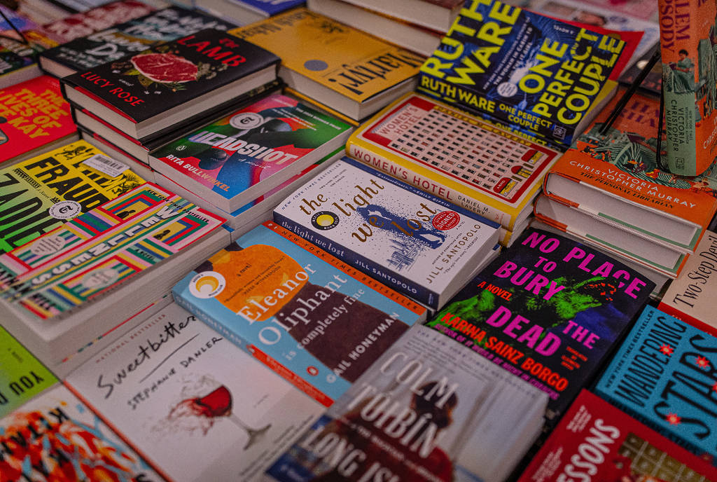 Image shows a table of books. 