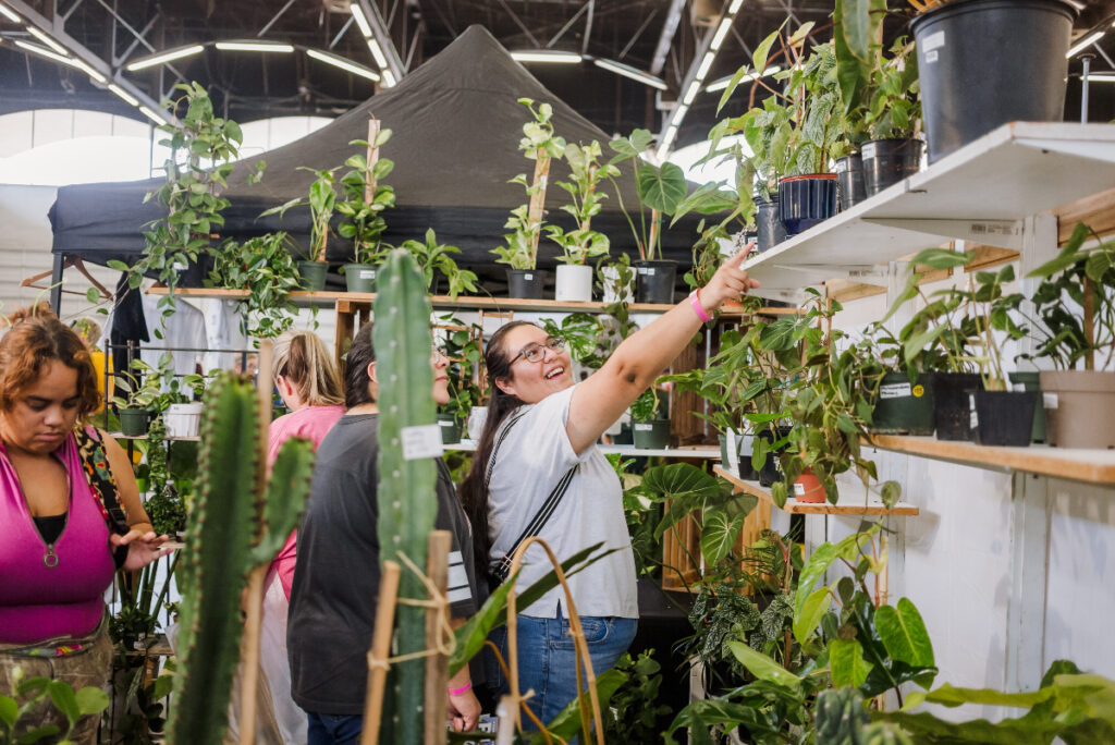 Image shows visitors and booths at PlantCon in Houston.