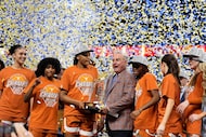 Texas celebrates after their win against South Carolina in an NCAA college basketball game...