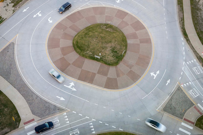 Traffic maneuvers a roundabout at Gaylord Parkway and John Hickman Parkway in Frisco on...