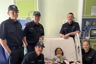 Members of Wise County Emergency Services District 3 pose with Lilah Bailey as she recovers...