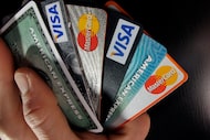 In this March 5, 2012, photo, consumer credit cards are posed in North Andover, Mass. 
