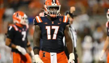 Illinois linebacker No. 17 stands poised pre-snap under the lights, highlighted as a defensive prospect in a 2026 NFL Mock Draft.