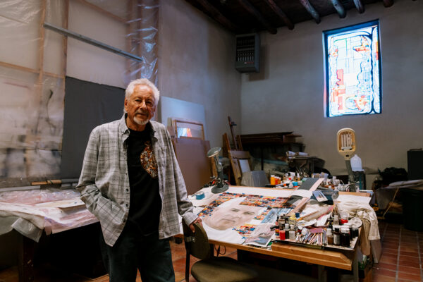 A photograph of artist Gaspar Enriquez in his studio.