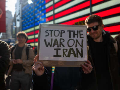 People gather in Times Square as the nation reacts to "major combat operations" in Iran on February 28, 2026, in New York City.