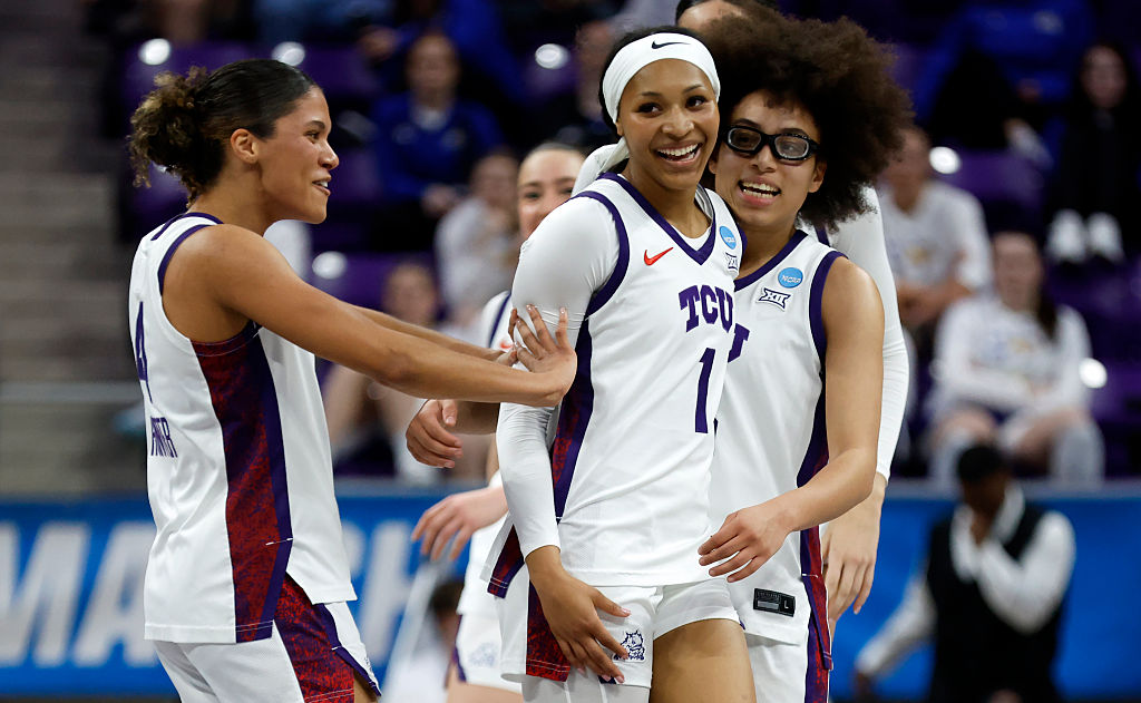 Taylor Bigby #1 of the TCU Horned Frogs celebrates with teammates Donovyn Hunter #4 and Olivia Miles #5 in the first half against the UC San Diego Tritons during the first round of the NCAA Women's Basketball Tournament on March 20, 2026 in Fort Worth, Texas.