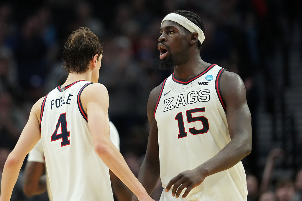 PORTLAND, OREGON - MARCH 19: Davis Fogle #4 and Graham Ike #15 of the Gonzaga Bulldogs celebrate against the Kennesaw State Owls during the second half in the first round of the 2026 NCAA Men's Basketball Tournament at Moda Center on March 19, 2026 in Portland, Oregon. (Photo by Soobum Im/Getty Images)
