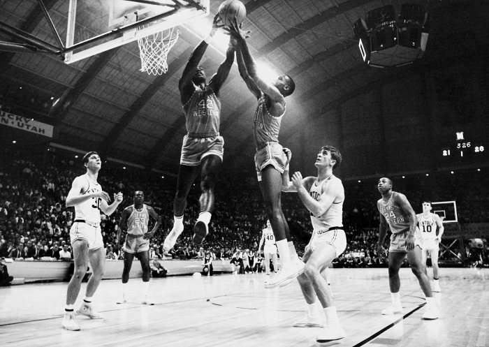 David Lattin and a Texas Western teammate compete for control of a rebound with Kentucky's Tommy Kron.
