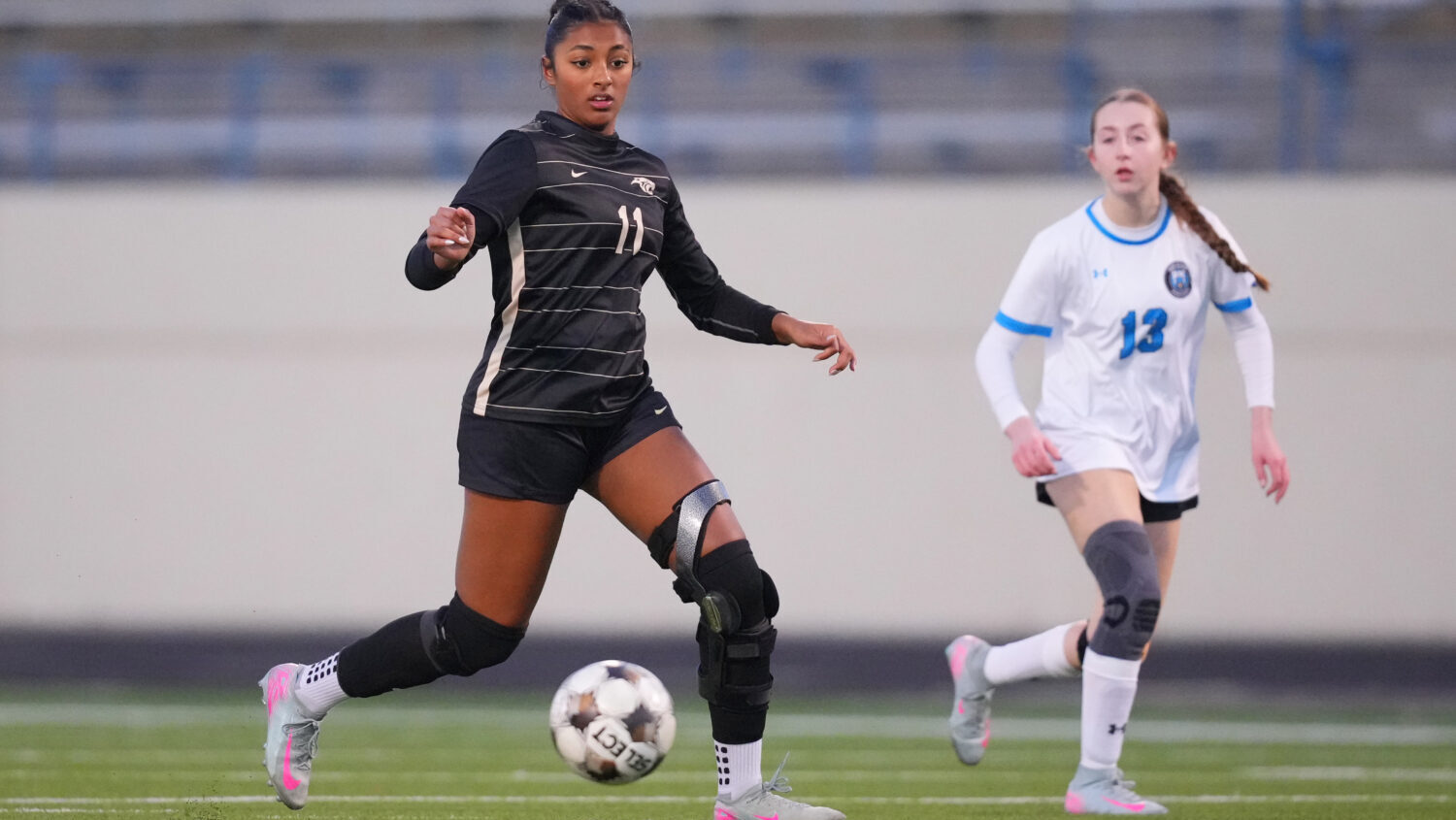 Plano East varsity soccer player Aliya Jacob, left, controls the ball against Rock Hill's Hanna Sch...